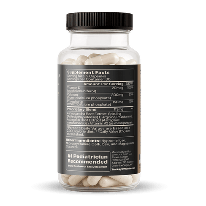 A clear plastic TruHeight Vitamins bottle contains numerous off-white capsules, displaying a black label with Supplement Facts, a proprietary blend featuring Ashwagandha and Spirulina, and a #1 Pediatrician Recommended badge